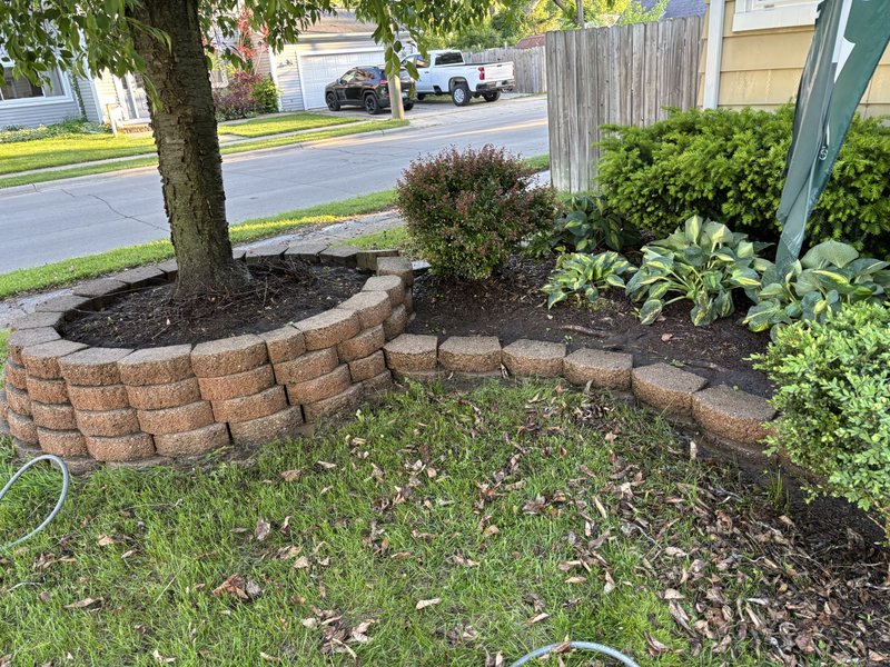 Landscaping after - new retaining wall and mulch